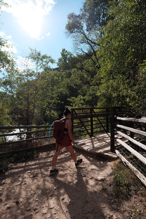 Hiking a shaded riverside trail