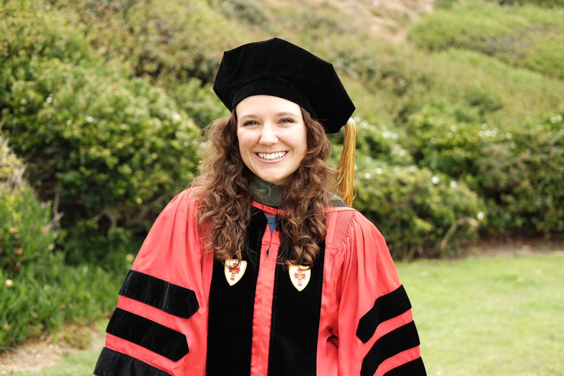 Dr. Nikki Giljohann (Latimer) smiling in doctoral regalia